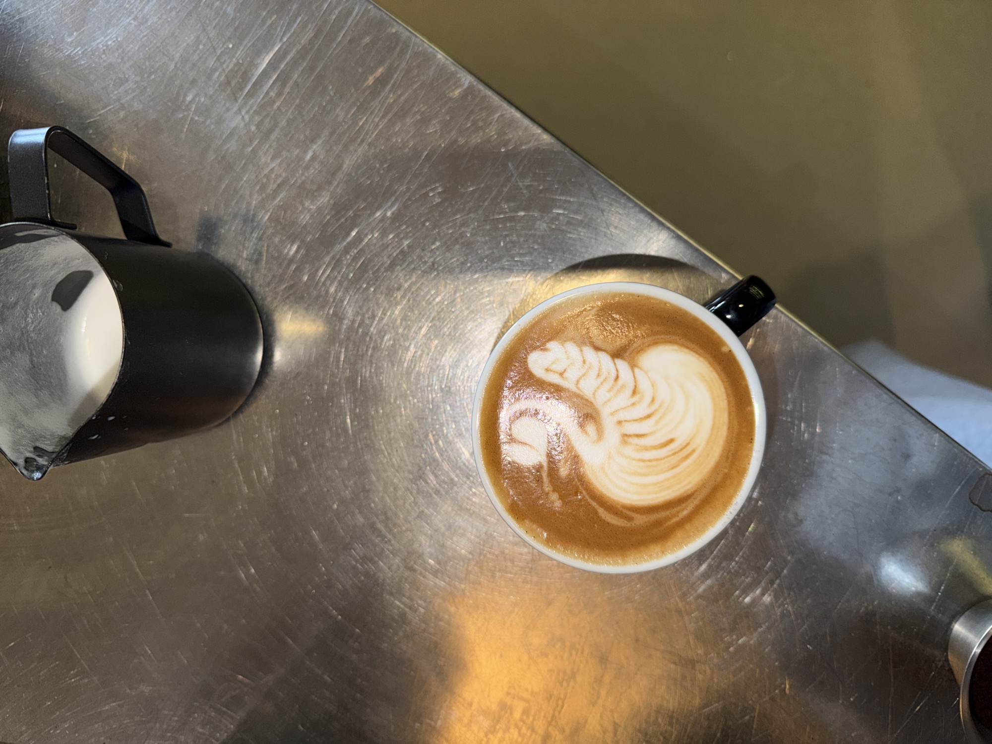Latte Art phoenix in an espresso cup